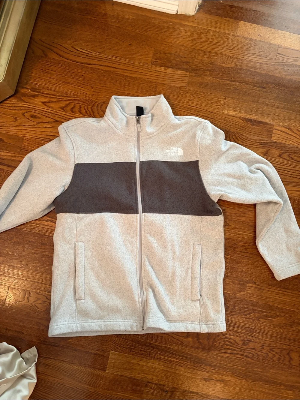 The North Face Kids Light Gray Fleece Jacket with Dark Gray Chest Panel